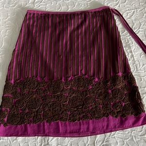 Hundred percent cotton brown embroidery on fuchsia